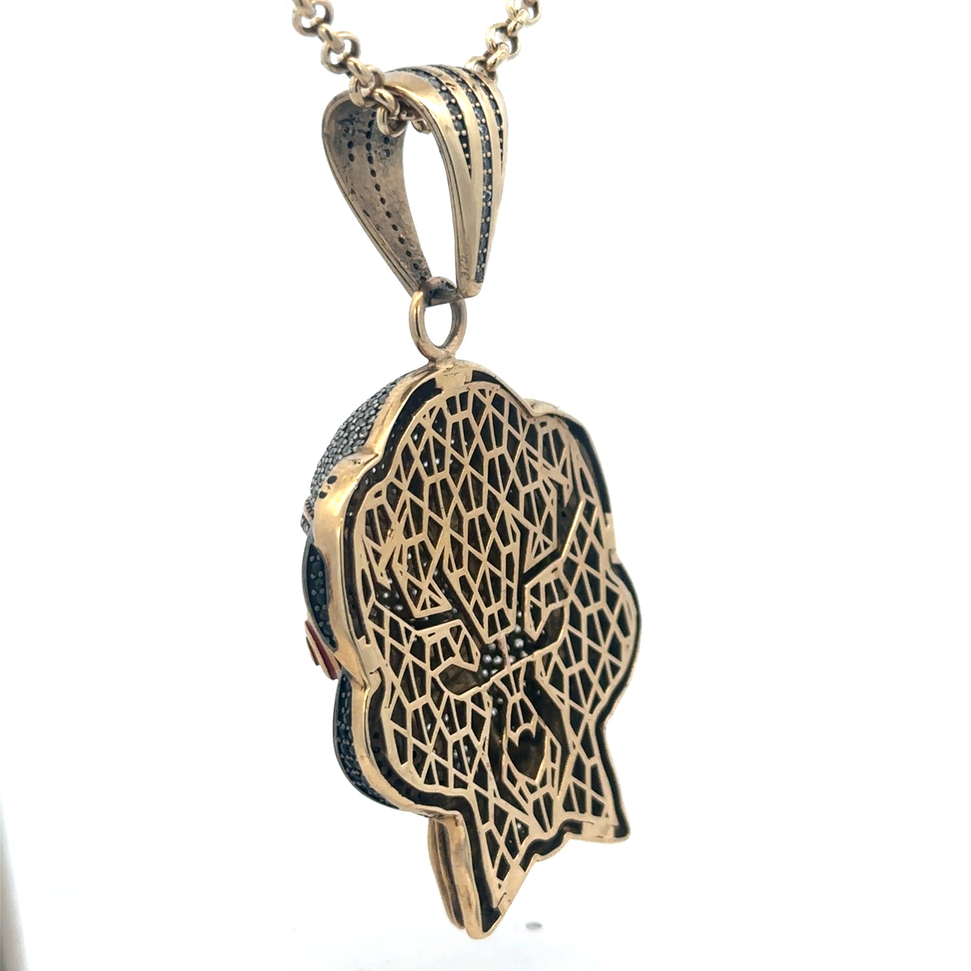 9ct yellow gold jigsaw pendant with detailed design, weighing 24.1g, crafted by Reeves and Sons.