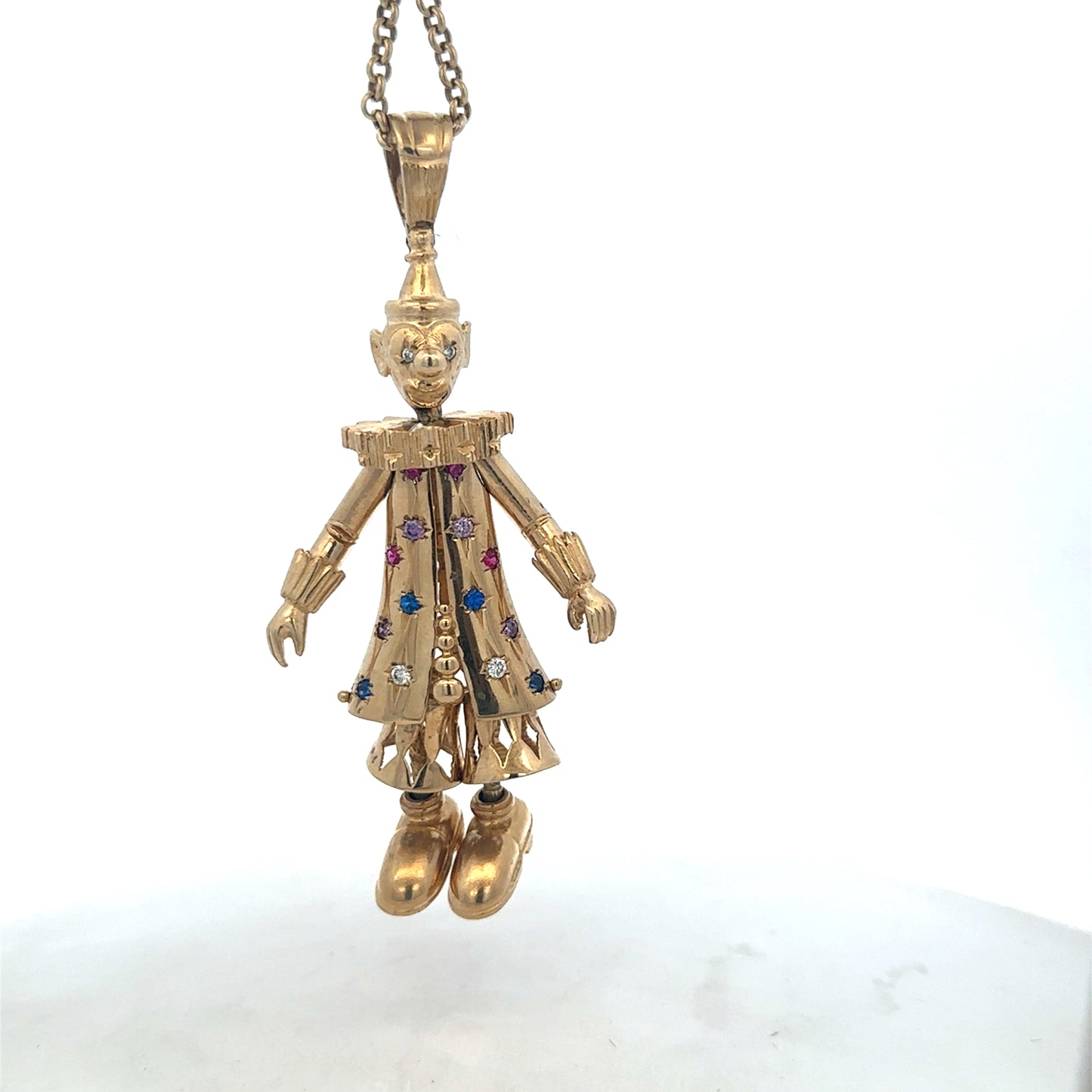 9ct yellow gold clown pendant with detailed craftsmanship, weighing 42.5g, from Reeves and Sons.