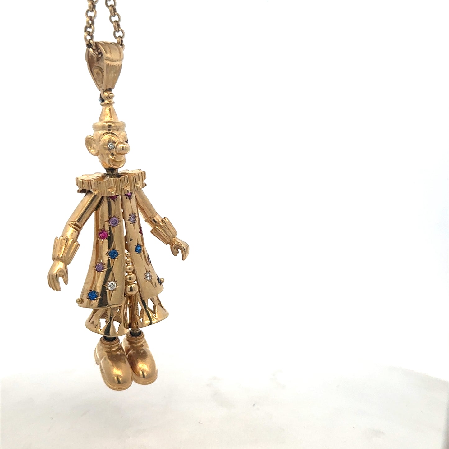 9ct yellow gold clown pendant with detailed design, weight 42.5g, from Reeves and Sons, shown on a plain background.