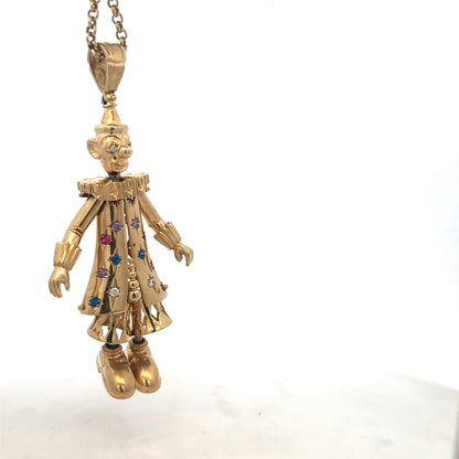 9ct yellow gold clown pendant with detailed design, weight 42.5g, from Reeves and Sons, shown on a plain background.