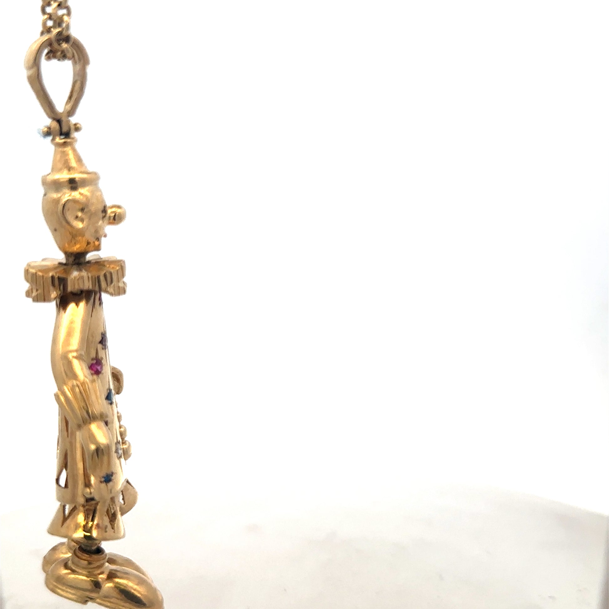 9ct yellow gold clown pendant weighing 42.5g, featuring a detailed clown design, crafted by Reeves and Sons.