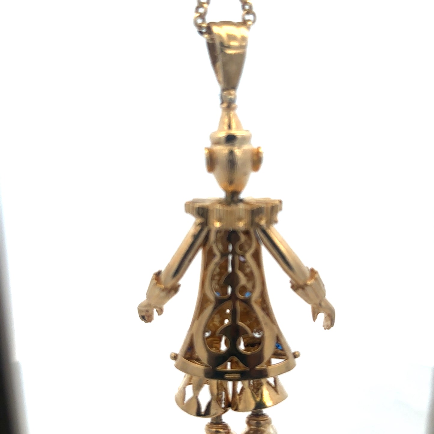 9ct yellow gold clown pendant with detailed face and cheerful expression, weighing 42.5g, from Reeves and Sons.