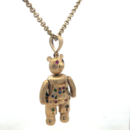 9ct yellow gold teddy bear pendant with detailed design, weighing 20.4g, from Reeves and Sons.
