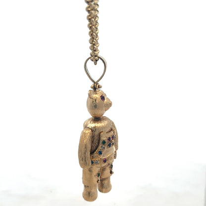 9ct yellow gold teddy bear pendant with detailed design, weighing 20.4g, crafted by Reeves and Sons.