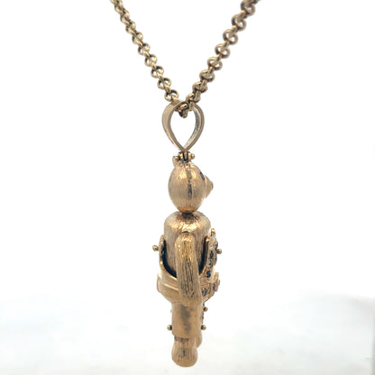 9ct yellow gold teddy bear pendant with detailed design, weighing 20.4g, crafted by Reeves and Sons.