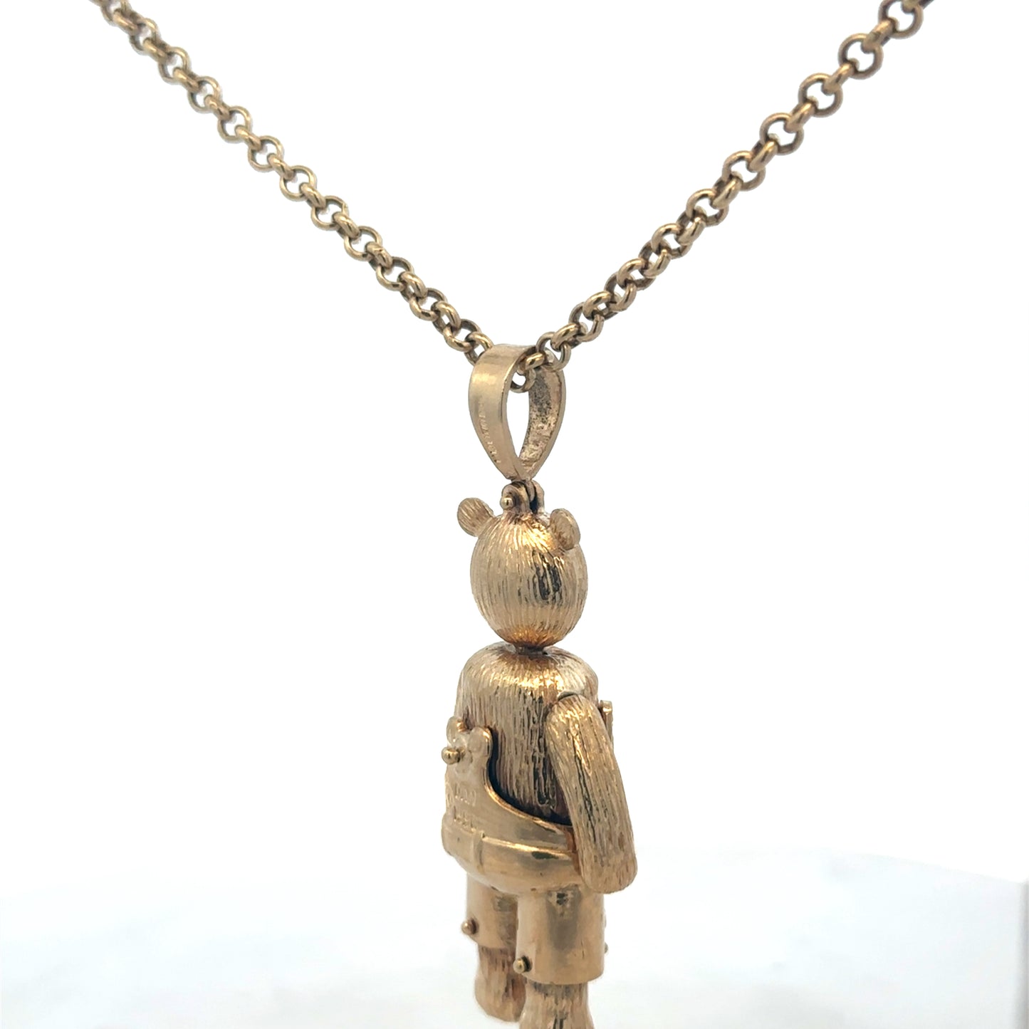 9ct yellow gold teddy bear pendant with detailed design, weighs 20.4g, crafted by Reeves and Sons.