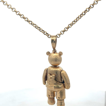 9ct yellow gold teddy bear pendant with detailed design, weighs 20.4g, crafted by Reeves and Sons.