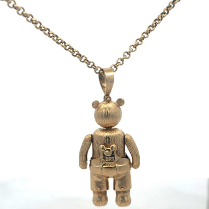 9ct yellow gold teddy bear pendant with detailed engraving, weight 20.4g, from Reeves and Sons, shown on a neutral background.