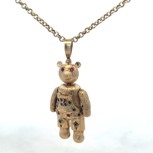 9ct yellow gold teddy bear pendant from Reeves and Sons, featuring detailed craftsmanship and a charming design.
