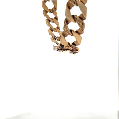 9ct yellow gold bracelet weighing 29.5g with a polished finish, featuring a classic chain design from Reeves and Sons.