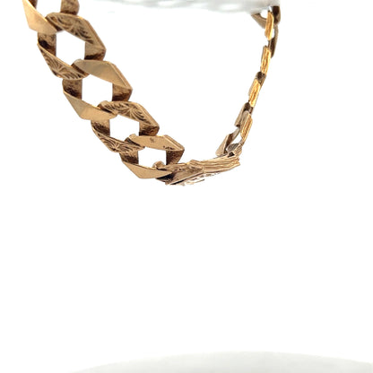 Reeves and Sons 9ct yellow gold bracelet weighing 29.5g with intricate link design displayed on a white background.