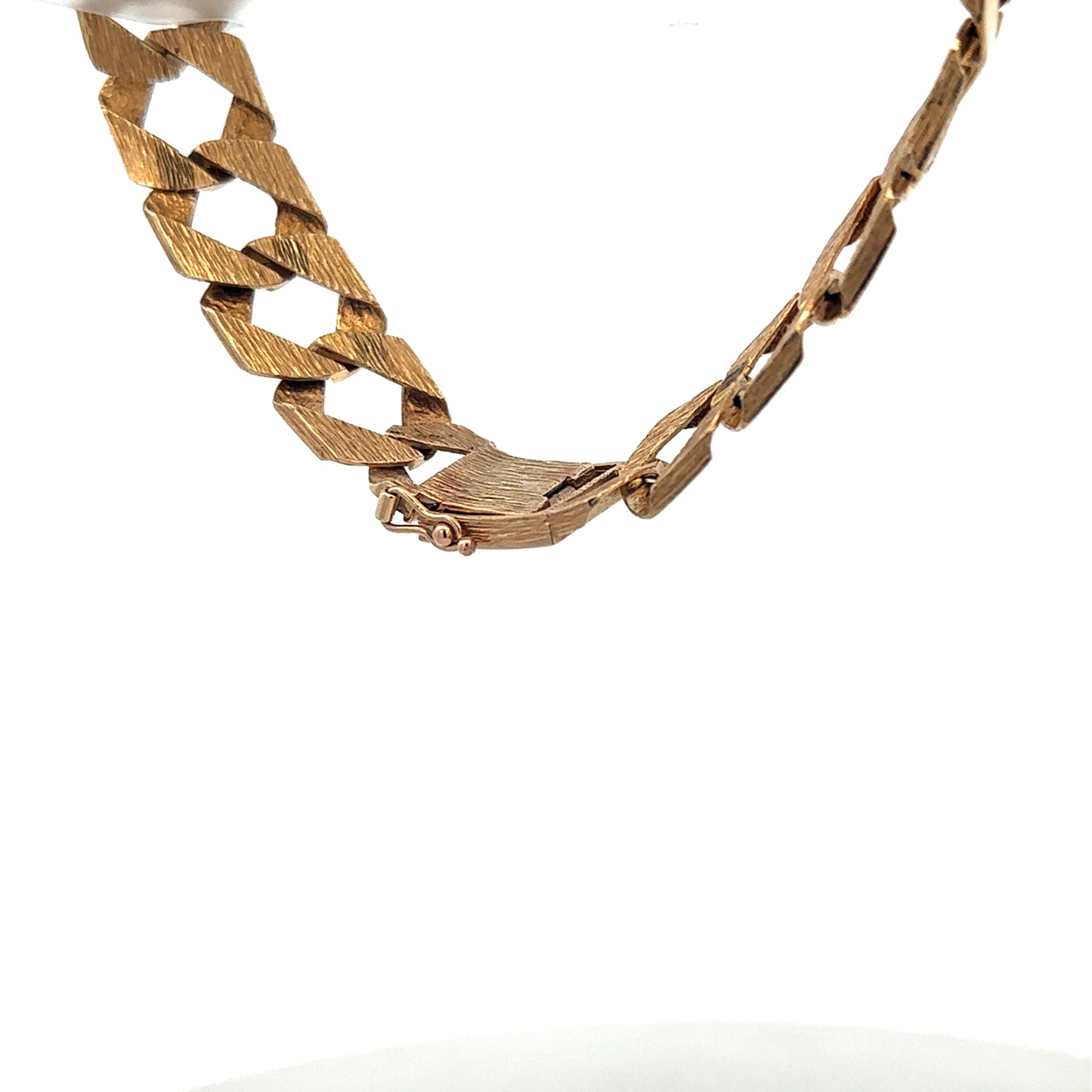 Reeves and Sons 9ct yellow gold bracelet weighing 29.5g, featuring a smooth, polished design and secure clasp.