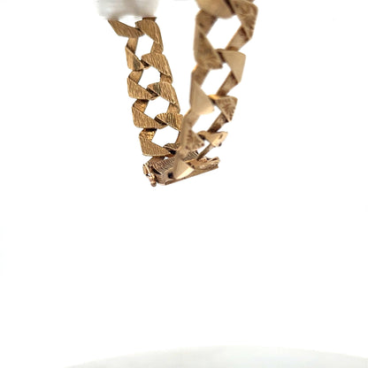 9ct yellow gold bracelet weighing 29.5g with intricate link design from Reeves and Sons.