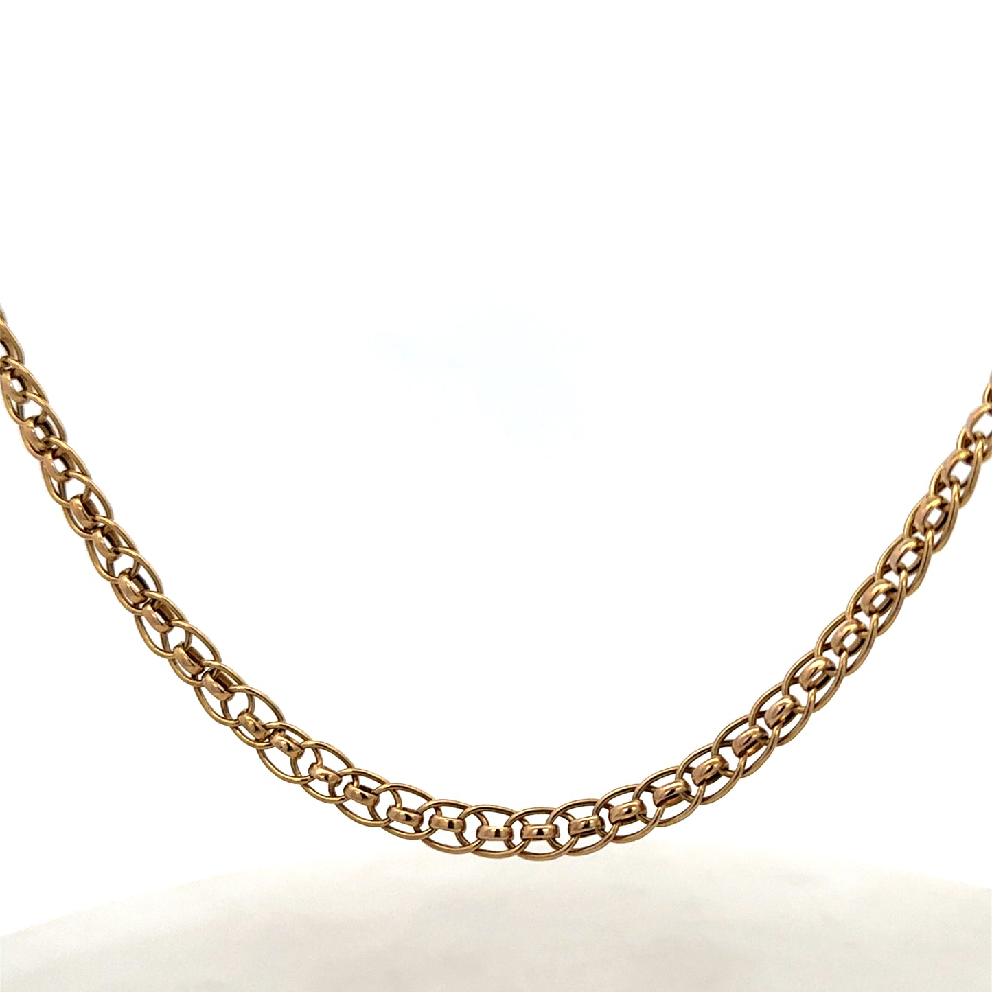 9ct yellow gold double linked chain from Reeves and Sons, weighing 7.9g, with a detailed view of the links and gold finish.