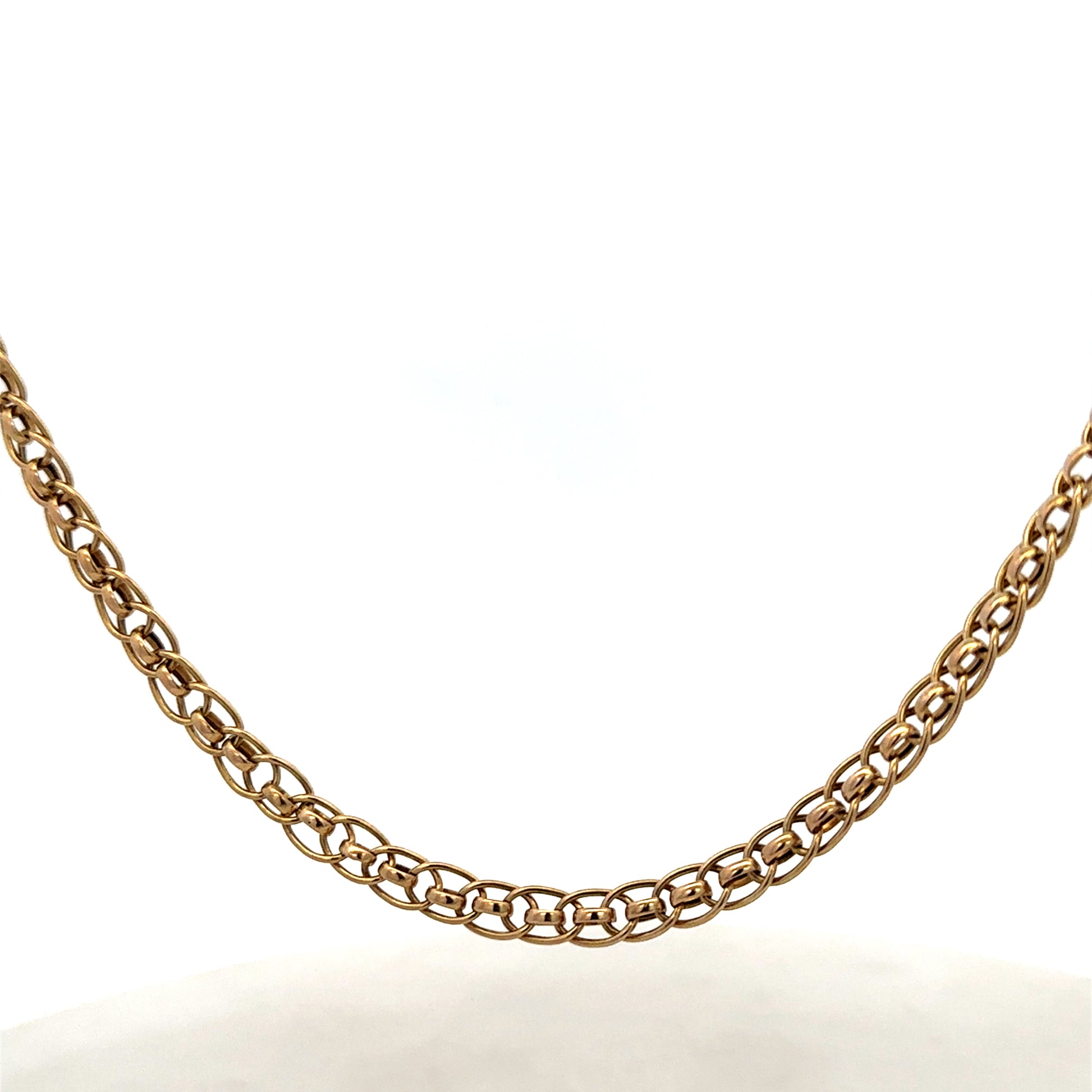 9ct yellow gold double linked chain from Reeves and Sons, weighing 7.9g, with a detailed view of the links and gold finish.