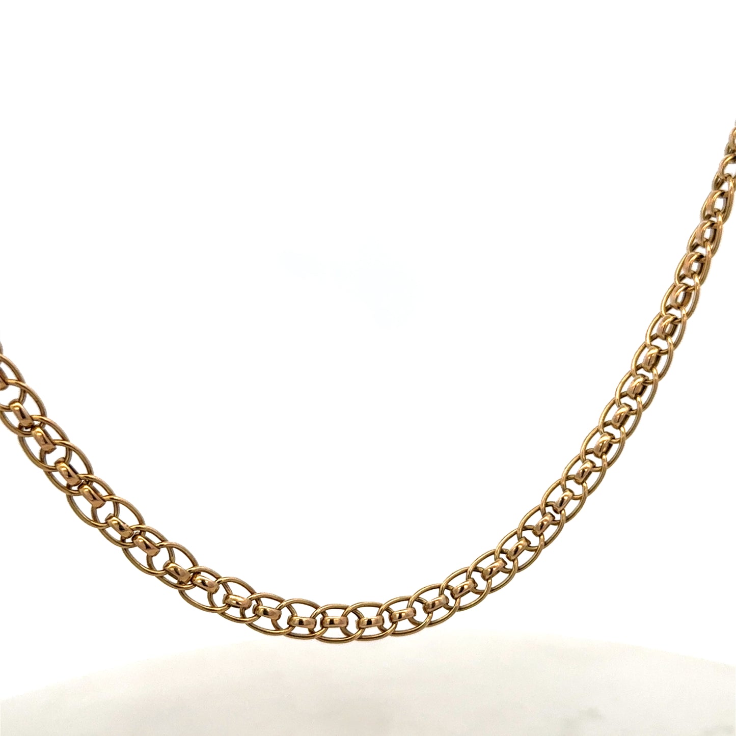 9ct yellow gold double linked chain weighing 7.9g, showcasing shiny, interconnected gold links from Reeves and Sons.