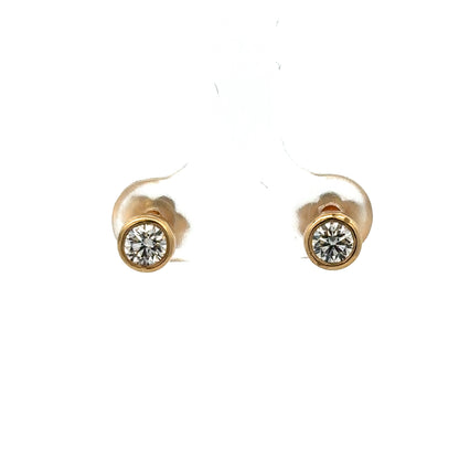Reeves and Sons 18ct gold lab-grown diamond stud earrings with 0.84 carats, featuring two sparkling diamonds in a classic setting.