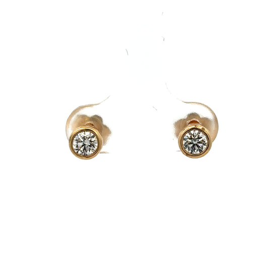 Reeves and Sons 18ct gold lab-grown diamond stud earrings with 0.84 carats, featuring two sparkling diamonds in a classic setting.