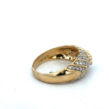 18ct yellow gold diamond ring by Reeves and Sons, size P, featuring sparkling diamonds and elegant design.