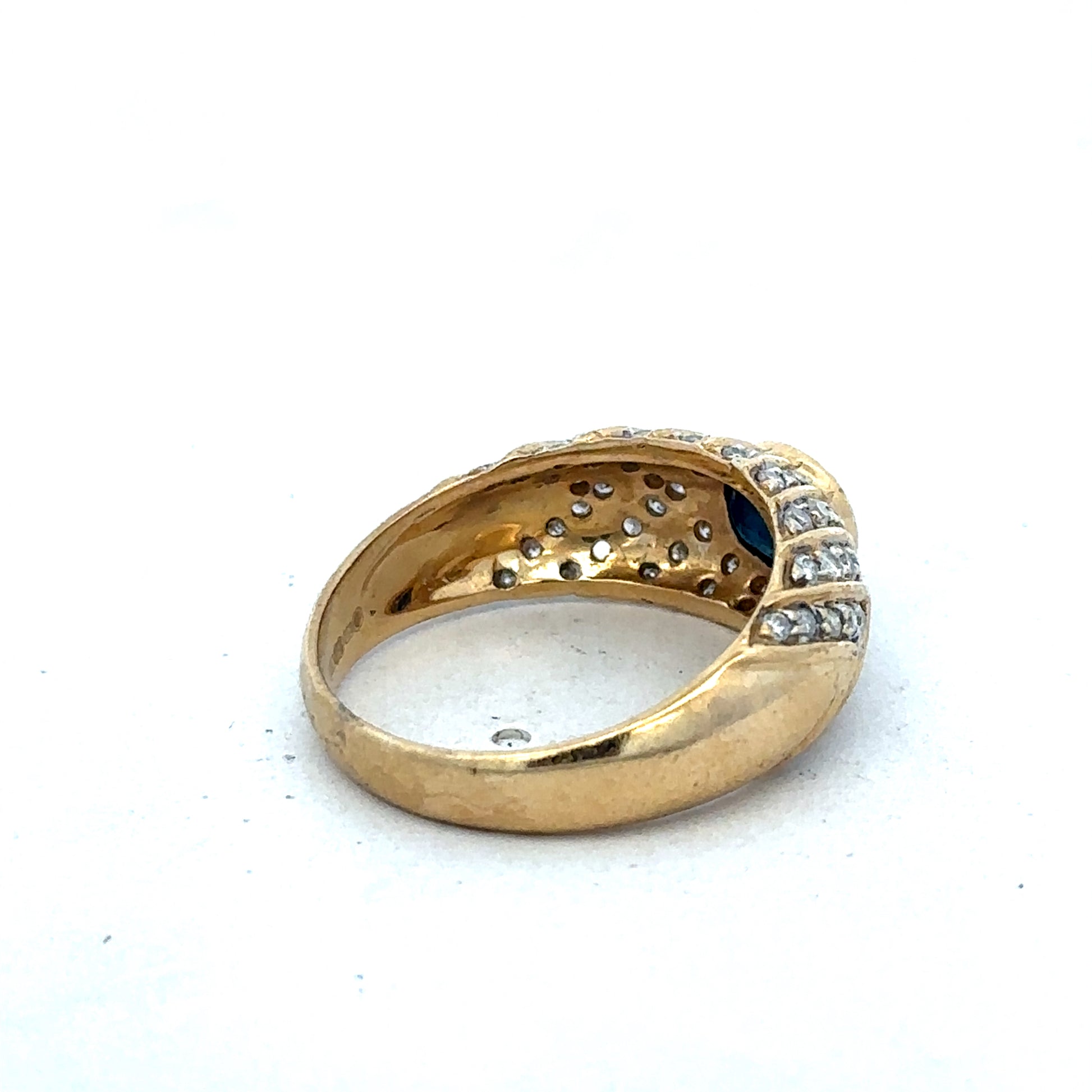 18ct yellow gold diamond ring by Reeves and Sons, size P, featuring a sparkling diamond centerpiece.