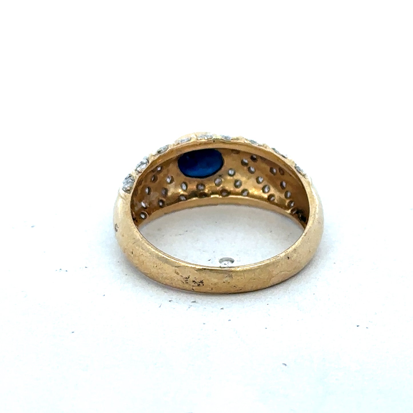 18ct yellow gold diamond ring by Reeves and Sons, size P, featuring sparkling diamonds on a polished band.