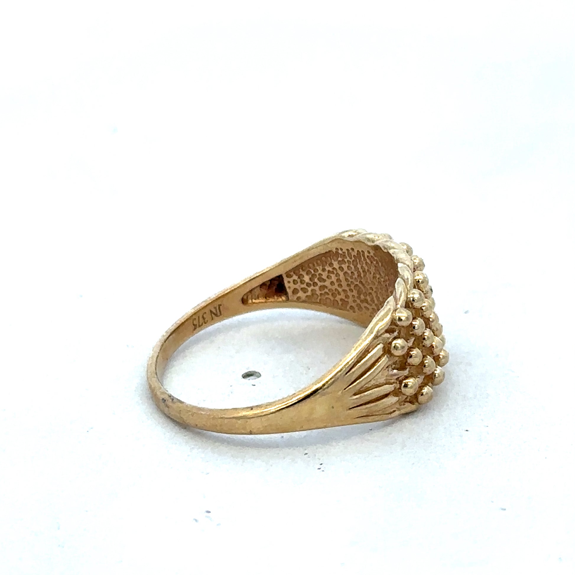 9ct yellow gold keeper ring in size W with a polished finish, crafted by Reeves and Sons.