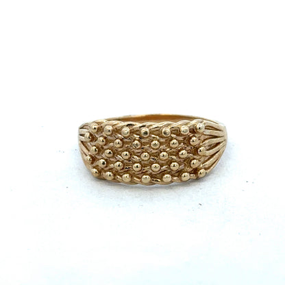 9ct yellow gold keeper ring size W by Reeves and Sons, close-up of a polished gold ring with a smooth band.