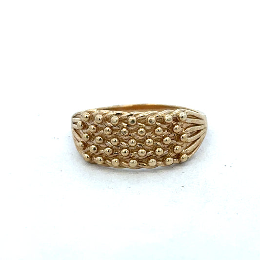 9ct yellow gold keeper ring size W by Reeves and Sons, close-up of a polished gold ring with a smooth band.