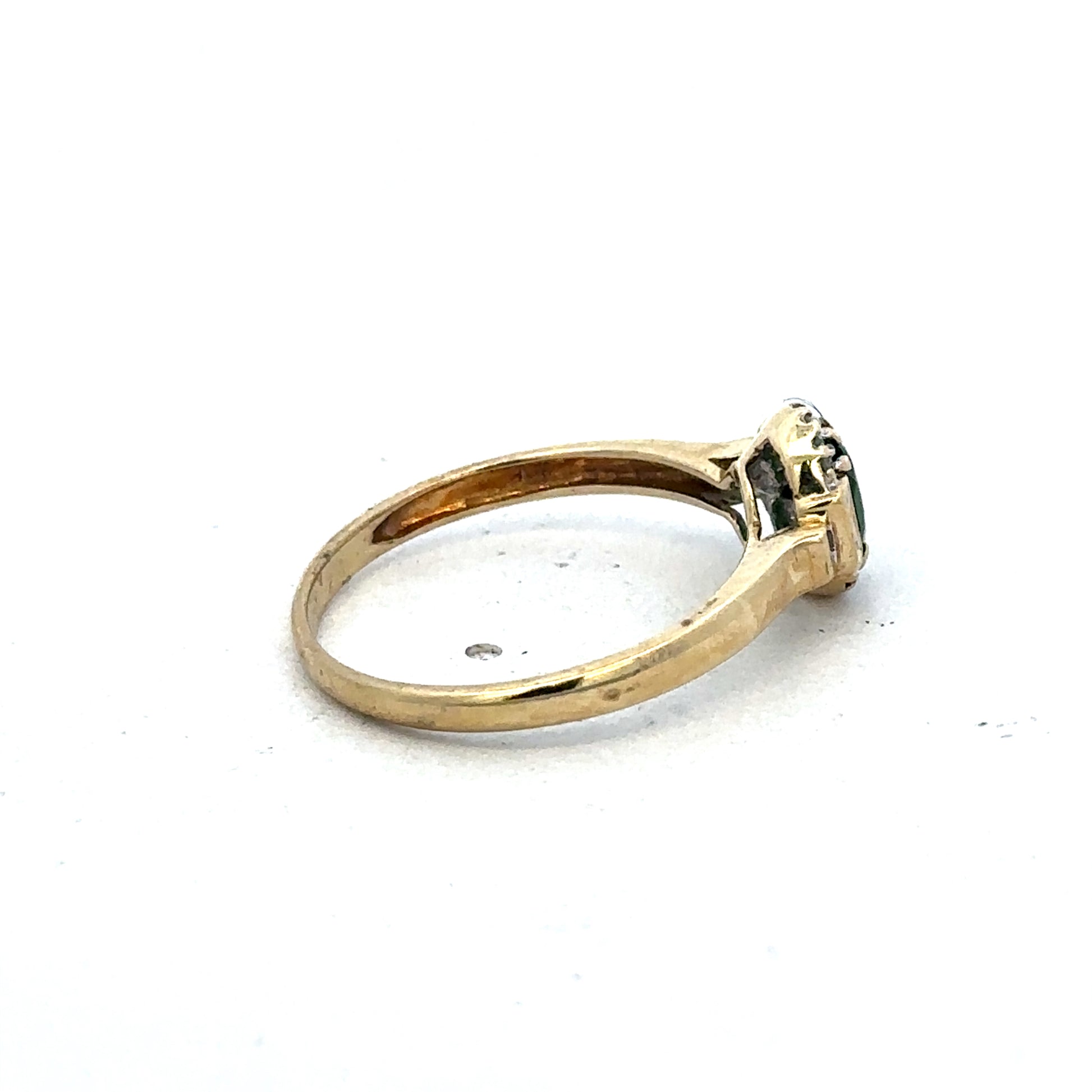 9ct yellow gold emerald and diamond ring by Reeves and Sons, size R, featuring a central emerald and sparkling diamonds.