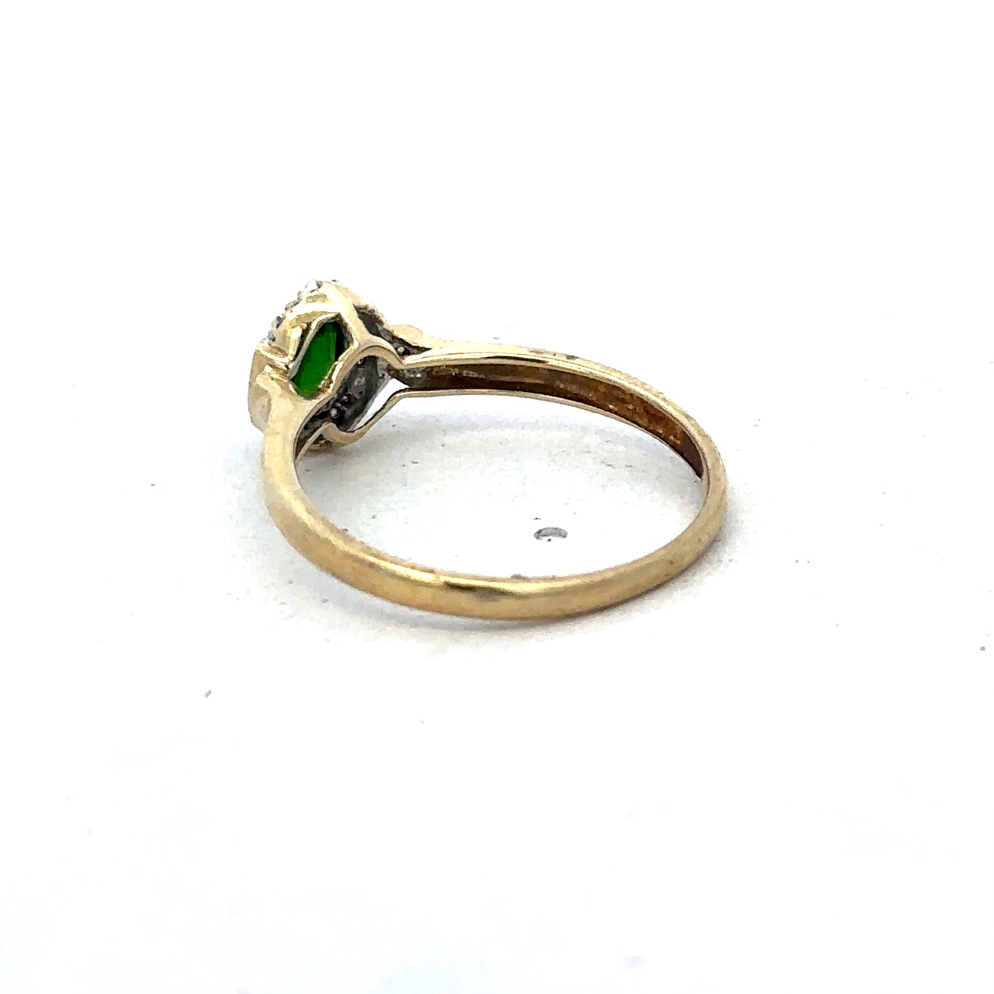 9ct yellow gold emerald and diamond ring, size R, featuring intricate design by Reeves and Sons.