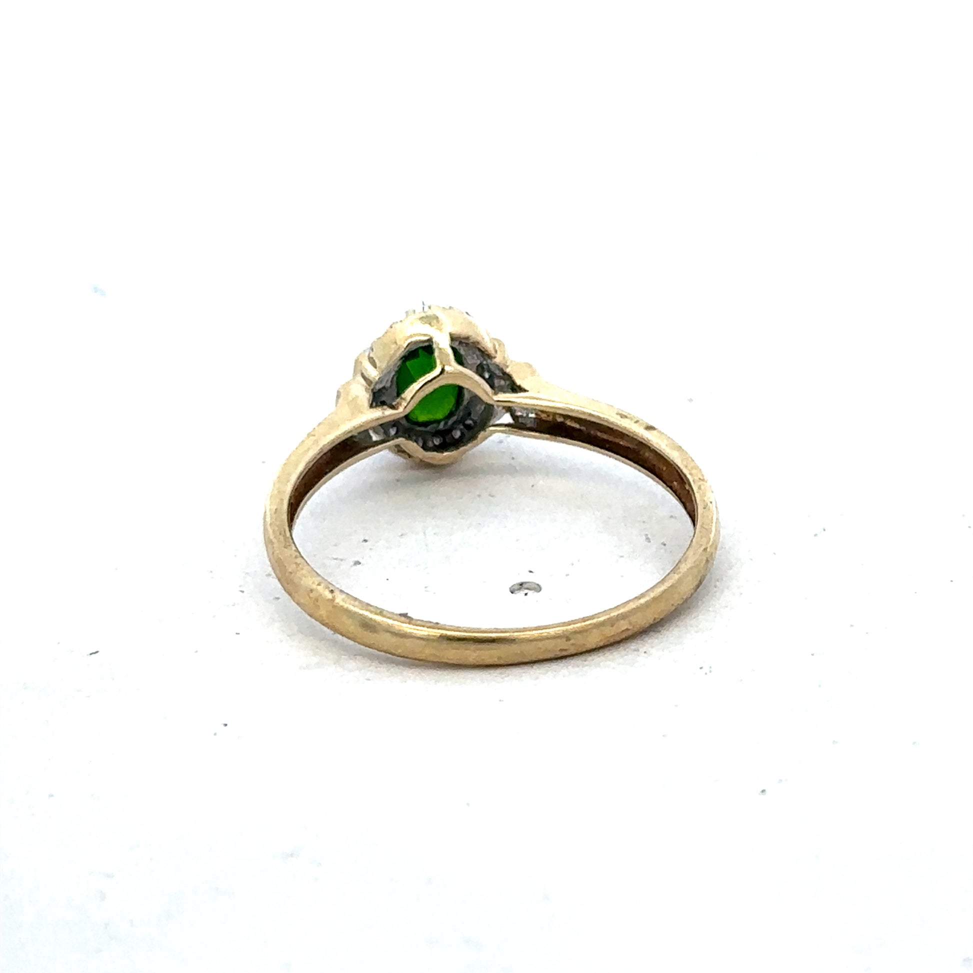 9ct yellow gold emerald and diamond ring with intricate band design, size R, by Reeves and Sons.