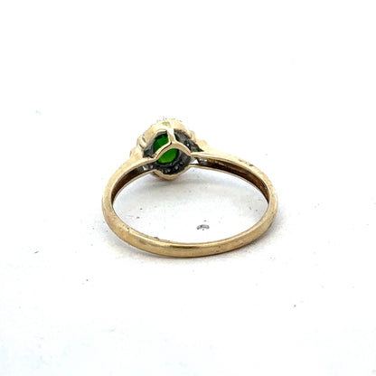 9ct yellow gold emerald and diamond ring with intricate band design, size R, by Reeves and Sons.