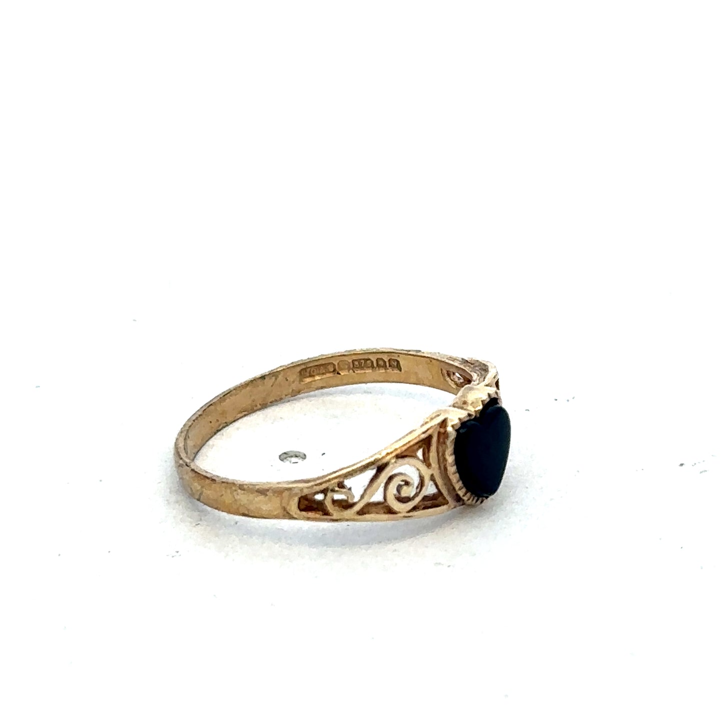 9ct yellow gold ring in size L by Reeves and Sons, featuring a smooth polished band, photographed on a plain background.