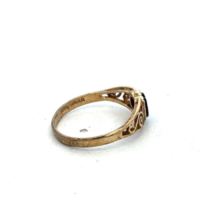 9ct yellow gold ring in size L with a smooth polished band, featuring a sleek and classic design by Reeves and Sons.