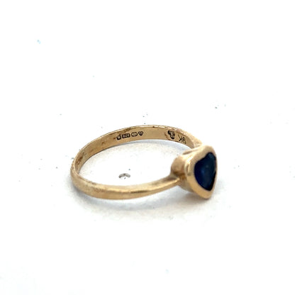 9ct yellow gold ring in size J by Reeves and Sons, featuring a smooth band design.