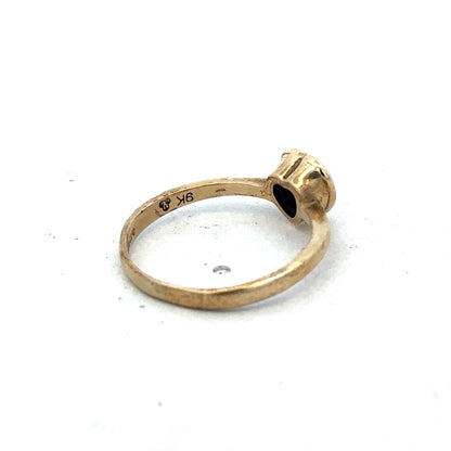 Reeves and Sons 9ct yellow gold ring size J with polished band and smooth finish, displayed on a neutral background.