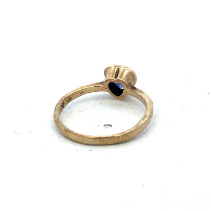 9ct yellow gold ring in size J with a smooth band, crafted by Reeves and Sons.