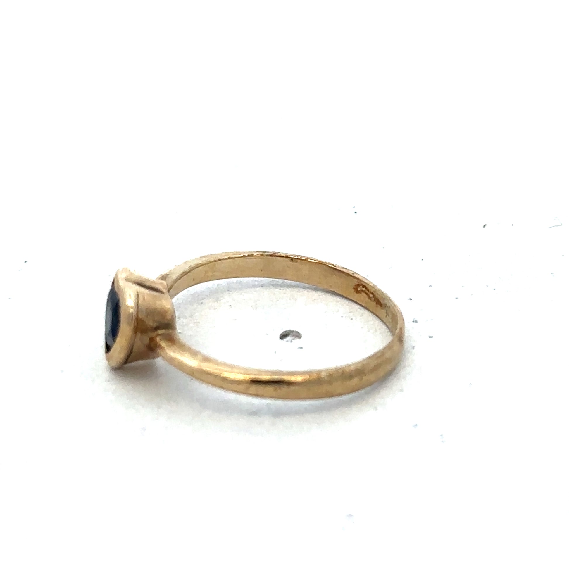 9ct yellow gold ring in size J from Reeves and Sons, featuring a smooth polished band.