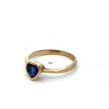 9ct yellow gold ring in size J with a smooth band, crafted by Reeves and Sons.
