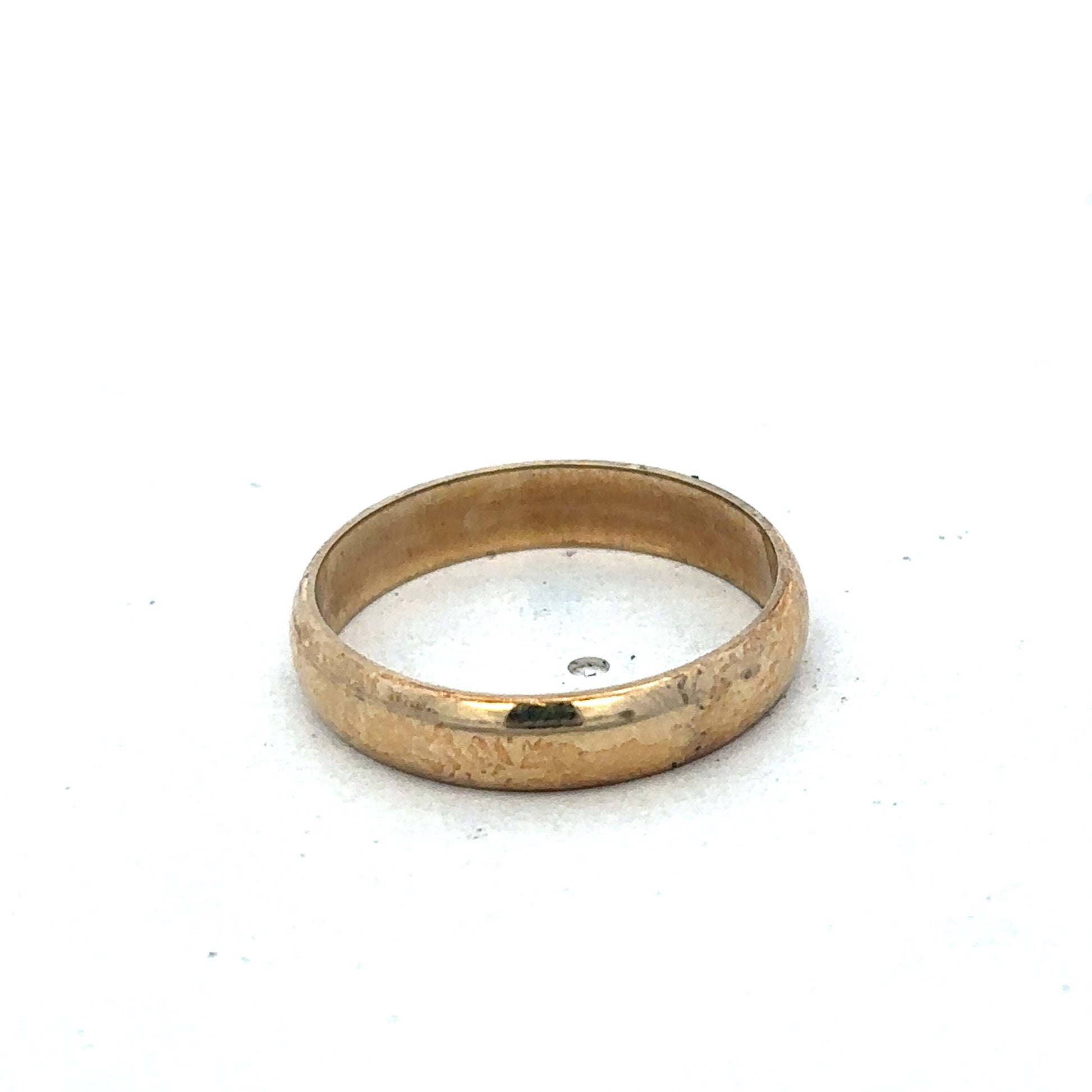 9ct yellow gold band ring in size N by Reeves and Sons, smooth polished finish, close-up view of the elegant jewelry piece.