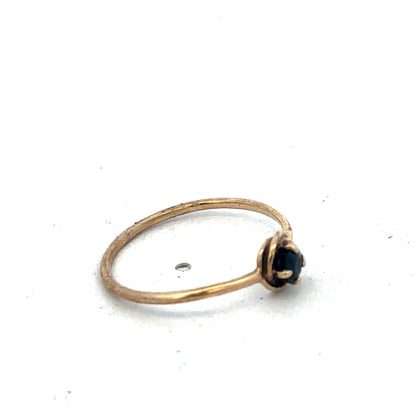 9ct yellow gold ring size M from Reeves and Sons, showcasing a polished band on a plain background.