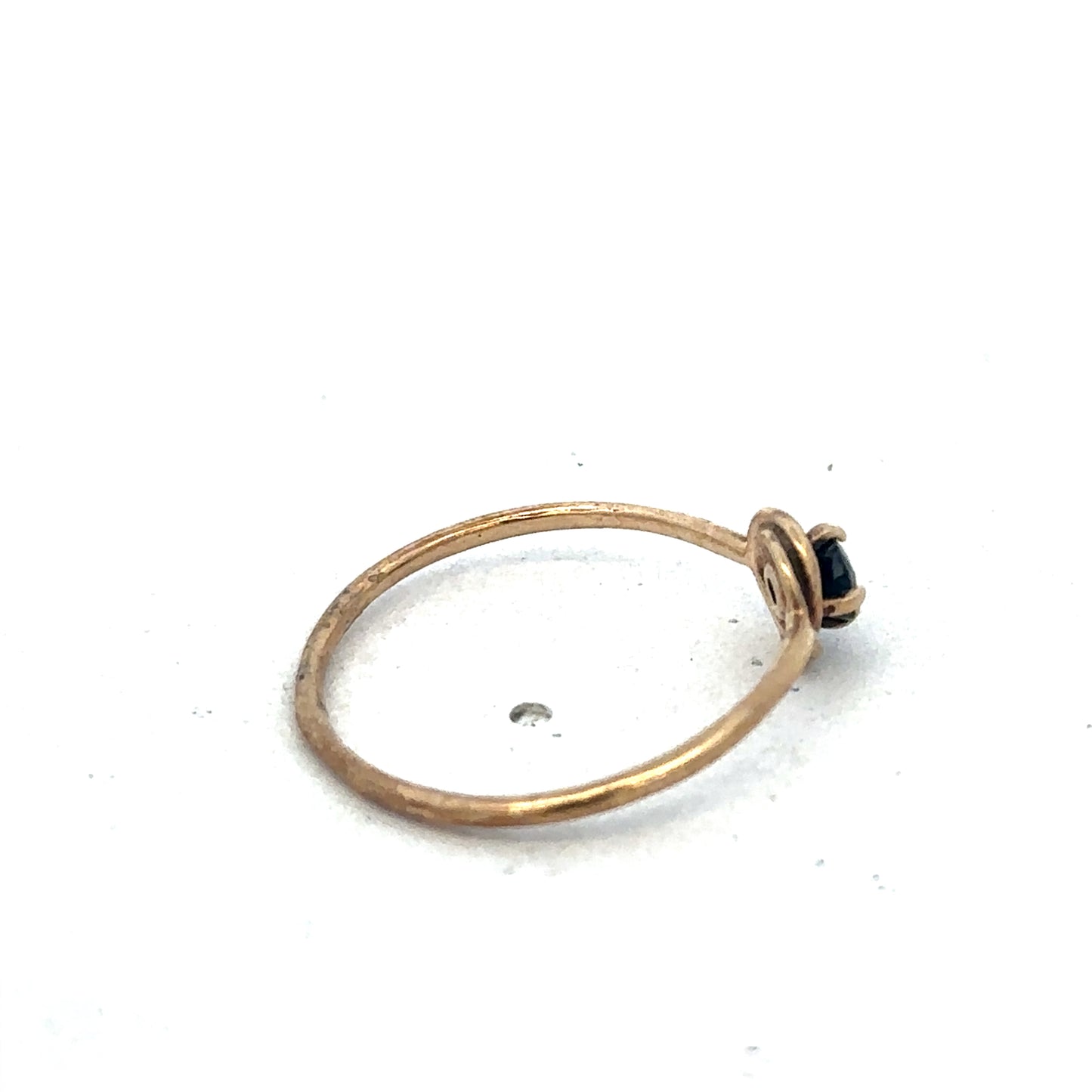 9ct yellow gold ring in size M by Reeves and Sons, featuring a smooth polished band, shown in close-up.
