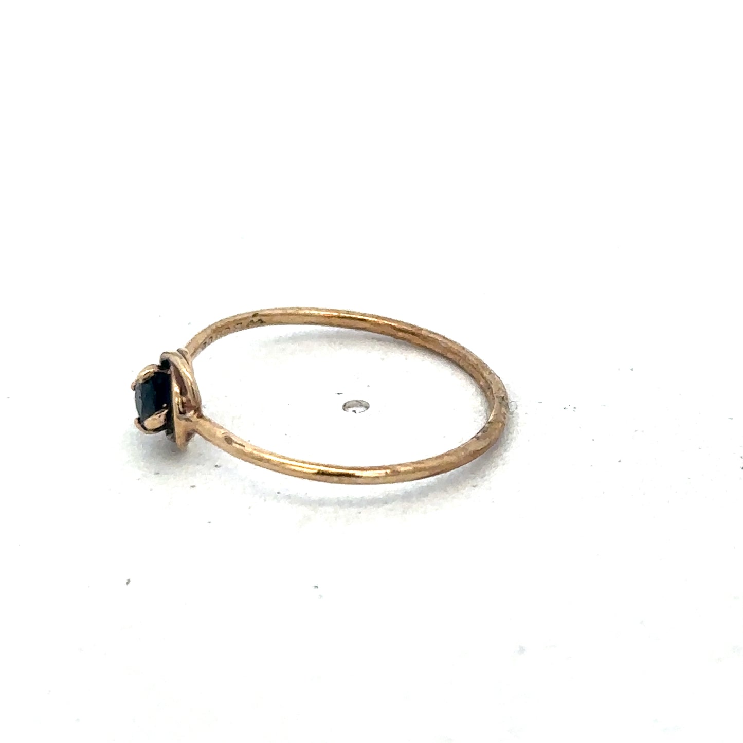 9ct yellow gold ring size M by Reeves and Sons, showcasing a smooth polished band.