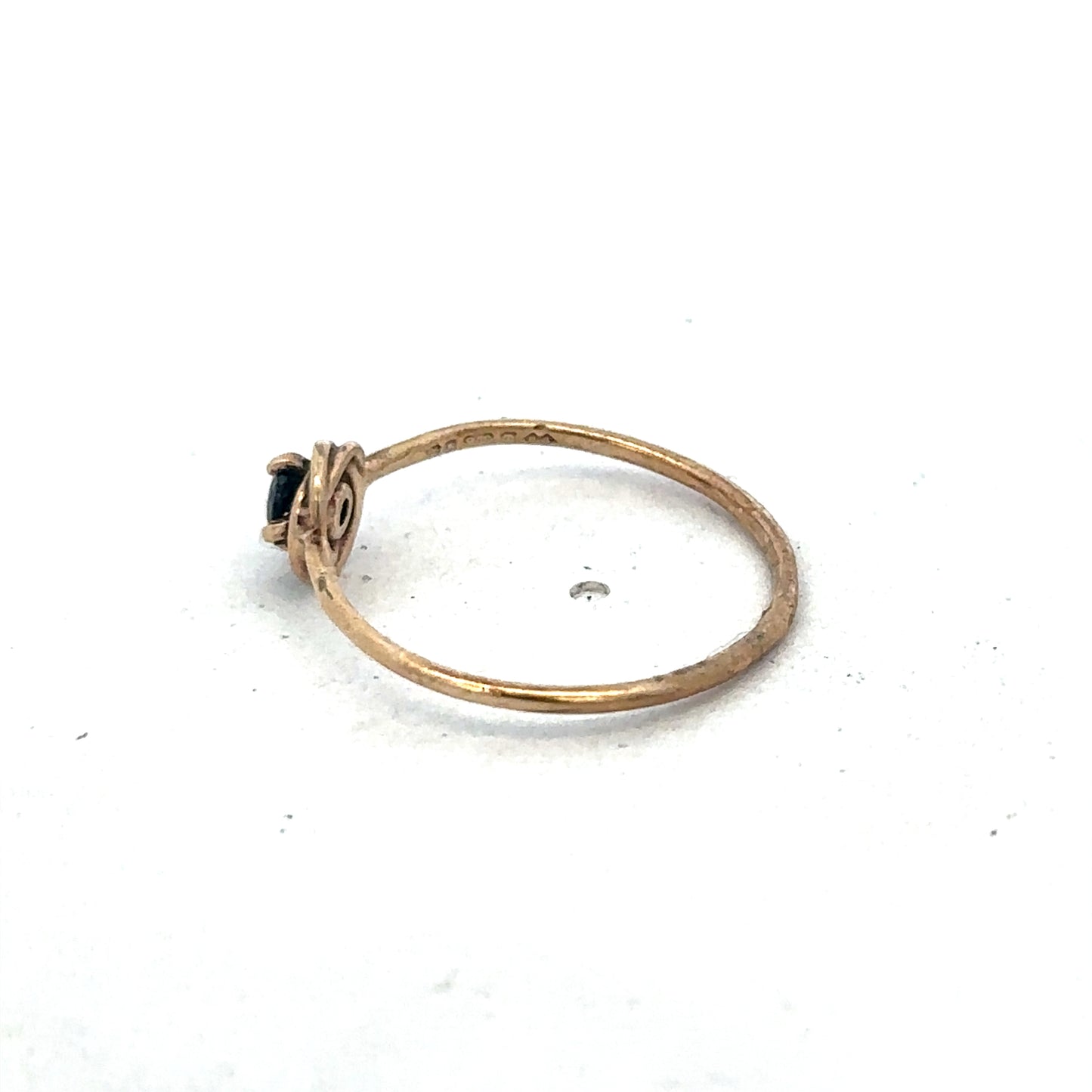 9ct yellow gold ring in size M by Reeves and Sons, featuring a smooth polished band and elegant design.