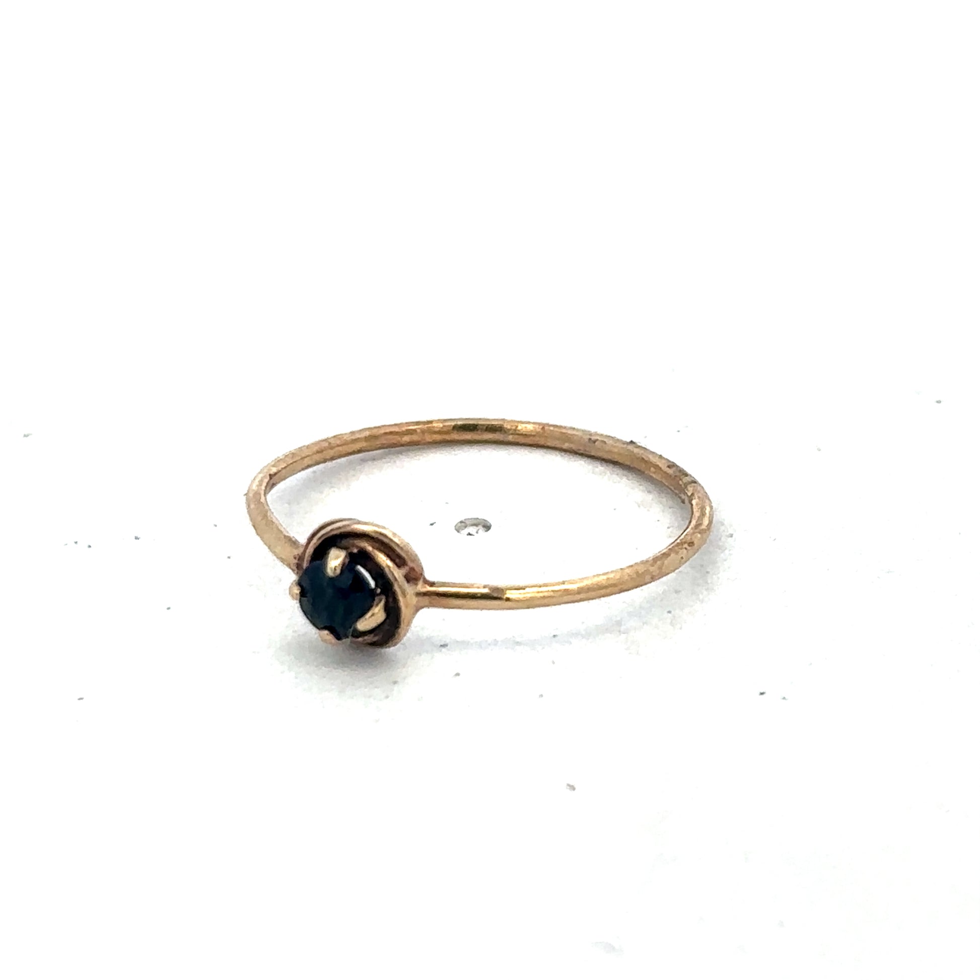 9ct yellow gold ring size M by Reeves and Sons, close-up of the elegant gold band with polished finish.