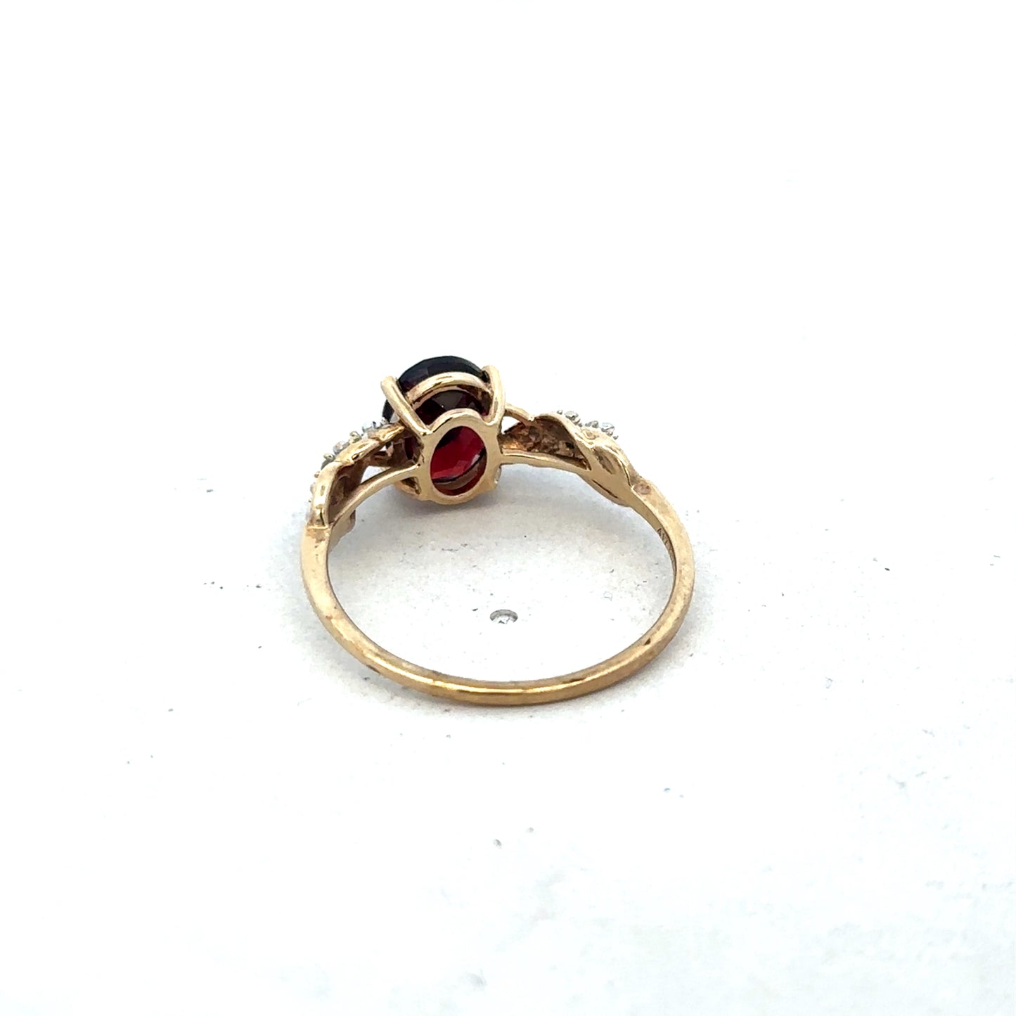 9ct yellow gold garnet and diamond ring in size R1/2, featuring intricate design and sparkling stones, by Reeves and Sons