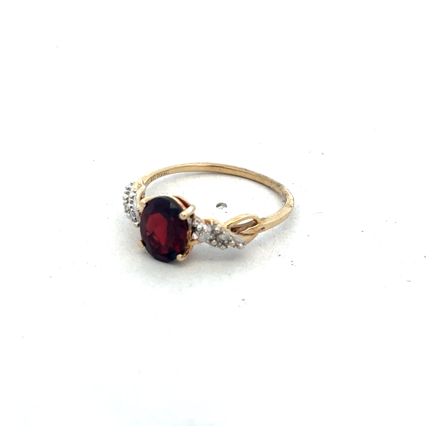 9ct yellow gold garnet and diamond ring with intricate design, size R1/2, featuring a deep red garnet and sparkling diamonds.