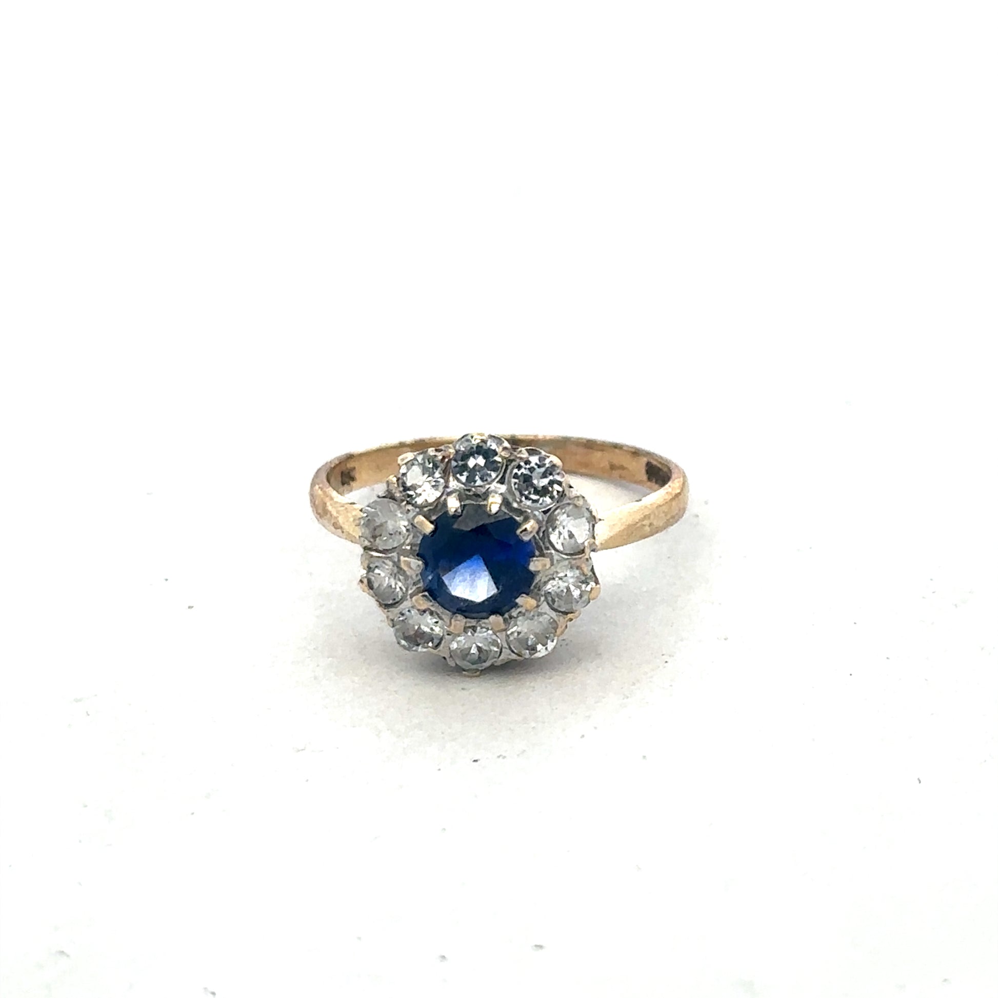 9ct yellow gold ring size N by Reeves and Sons, close-up showing smooth polished band and elegant design.