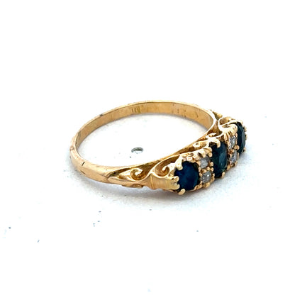 18ct yellow gold sapphire and diamond ring, size O, featuring a central sapphire with diamond accents, crafted by Reeves and Sons.