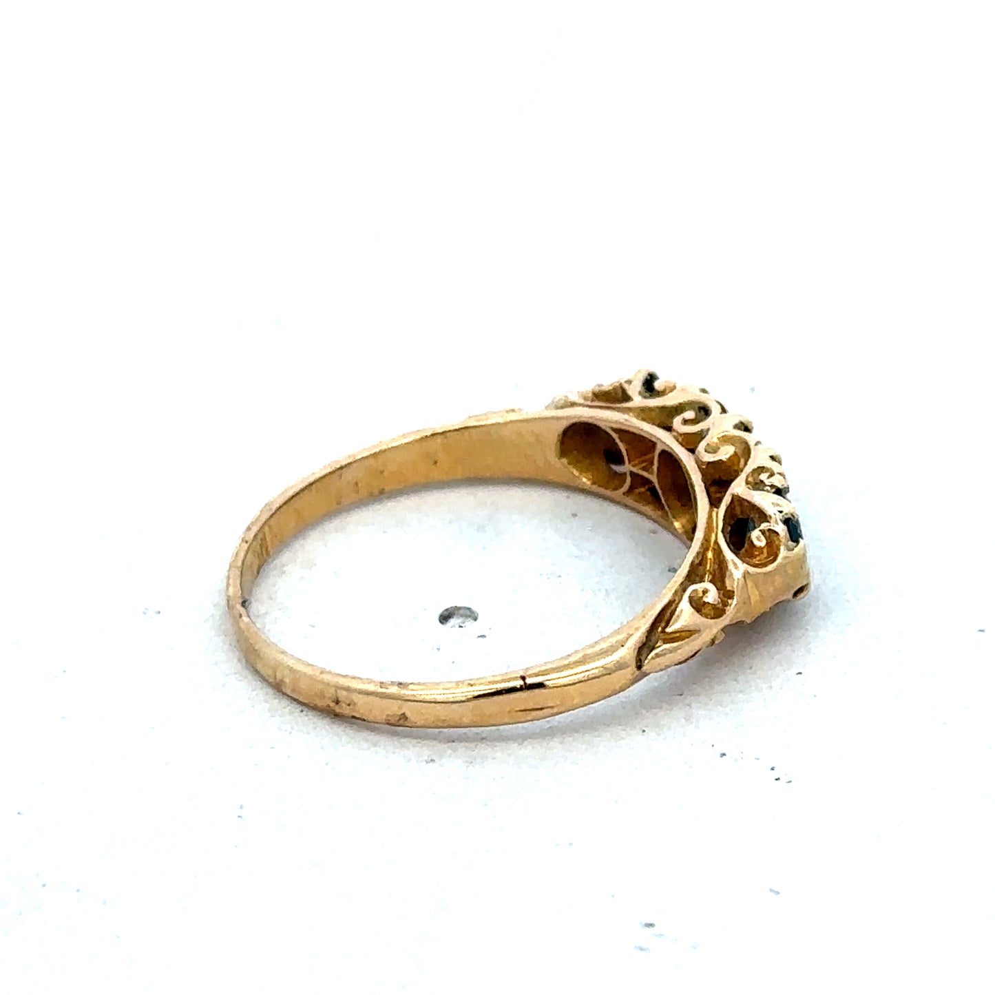 18ct yellow gold sapphire and diamond ring with a central sapphire and diamond accents, size O, by Reeves and Sons.